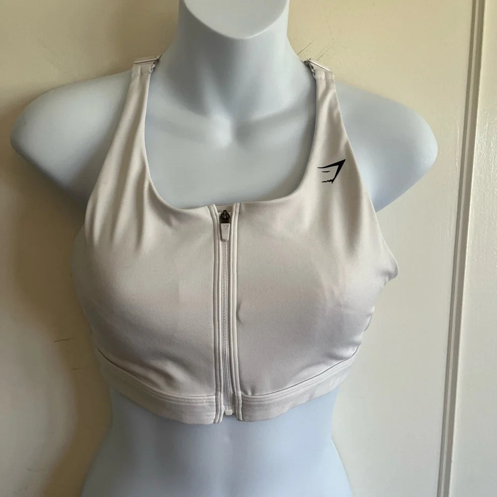 GYMSHARK ZIP UP SPORTS BRA
Medium  Support. Size medium white. SOLD OUT online.